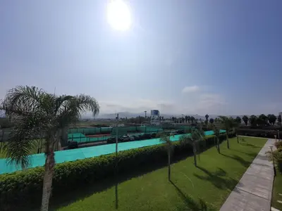 a swimming pool in a park with palm trees at Casa de playa Cala del Mar Experience in Bujama Baja