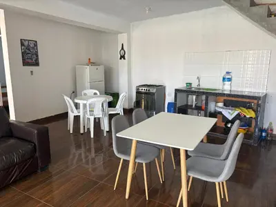 a living room with a white table and chairs at Casita de Playa 2026 in Supe