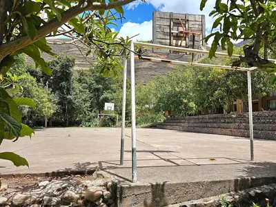 an empty basketball hoop in a parking lot at Condomino Villa Andina in Urubamba
