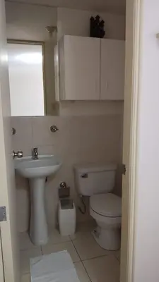 a small bathroom with a toilet and a sink at EL rincon feliz in San Antonio