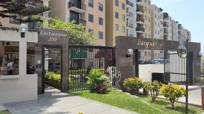 a black gate with a sign in front of a building at EL rincon feliz in San Antonio