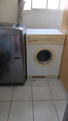 a washer and dryer in a kitchen with a counter at EL rincon feliz in San Antonio