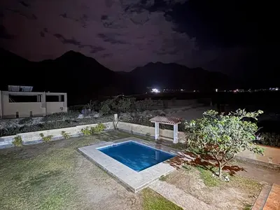 a small swimming pool in a yard at night at Casa de campo Rosenthal - Cieneguilla in Panquilma