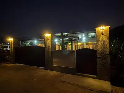 a house at night with lights in front of it at Casa de campo Rosenthal - Cieneguilla in Panquilma