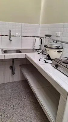a kitchen with a counter top with a sink at Departamento independiente anexo a vivienda familiar in La Tinguiña