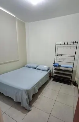 a bedroom with a bed in a room at Departamento independiente anexo a vivienda familiar in La Tinguiña