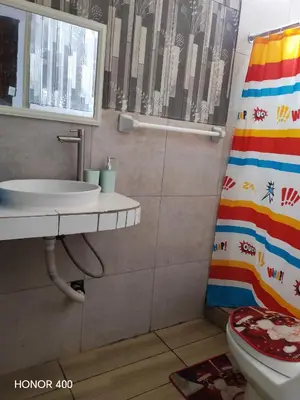 a bathroom with a sink and a toilet at Casita de camucha segundo piso in Chincha Baja