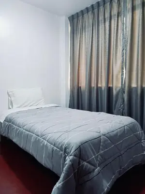 a bedroom with a bed and a window with curtains at Habitación cama dos plazas in Lima
