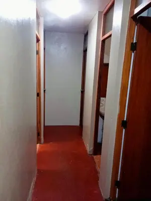 an empty hallway with two doors and a room with a hallway at Habitación cama dos plazas in Lima