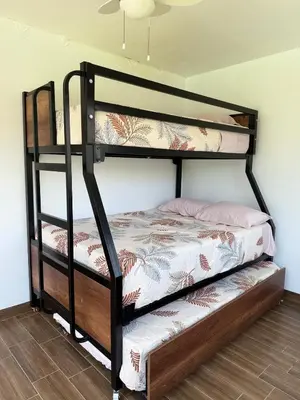 a bunk bed in a room with a bunk bedutenewayangering at Casa Hacienda El Triangulo - Asia del Campo in Asia