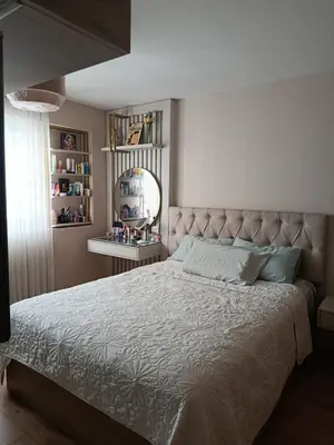 a bedroom with a large bed and a mirror at Apartamento amoblado in Lima