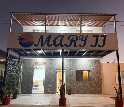 a sign for a may store with plants in front at Mary 2 in Paracas
