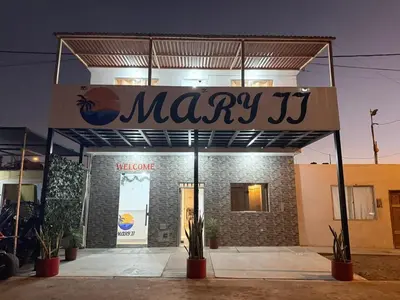 a may j sign in front of a store at Mary 2 in Paracas