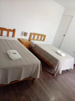 two beds sitting next to each other in a room at Mary 2 in Paracas