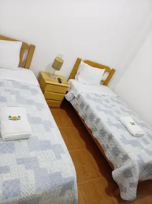 two beds sitting next to each other in a room at Mary 2 in Paracas