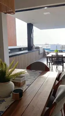 a dining room with a wooden table and chairs at Casa de Playa a 15min del boulevard de Asia in Cerro Azul