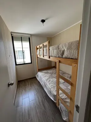 a bedroom with two bunk beds and a window at Modern apartment in Lima Surquillo in Lima