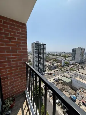 a balcony with a view of a city at Modern apartment in Lima Surquillo in Lima
