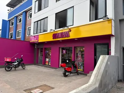 two scooters parked in front of a building at Modern apartment in Lima Surquillo in Lima