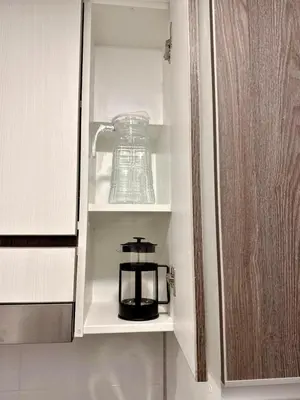 a blender sitting inside of a kitchen cabinet at seipoz in Lima