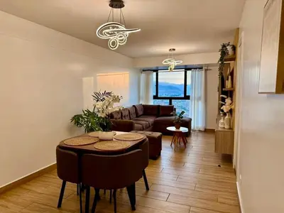 a living room with a couch and a table at seipoz in Lima