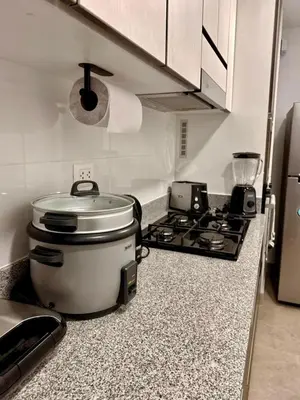 a kitchen with a slow cooker on a counter at seipoz in Lima