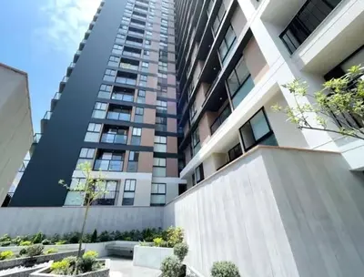 a tall apartment building with a fence in front of it at Cozy apartment, downtown area, fully equipped in Lima