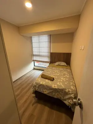 a bedroom with a bed in a room with a window at Confortable y moderno apartamento en Lima, cerca al centro de Lima, MIraflores y San IsidroN ISIDRO in Lima