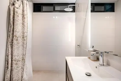 a bathroom with a sink and a shower at Bajada Balta Suites Spacious 3BR in Miraflores Walkable Area in Lima