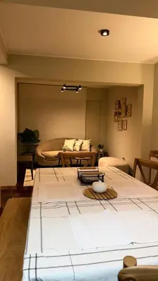 a living room with a bed and a couch at A2 cuadras de Larcomar - Miraflores in Lima