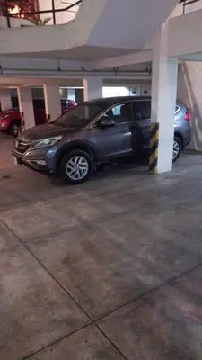 a silver car parked in a parking lot at A2 cuadras de Larcomar - Miraflores in Lima