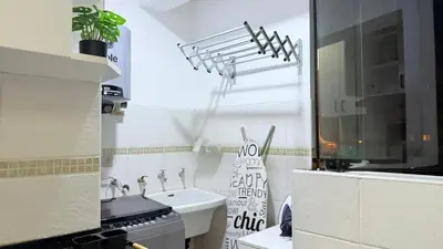 a small kitchen with a sink and a stove at A2 cuadras de Larcomar - Miraflores in Lima