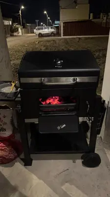 a black stove with a fire inside of it at Casa de estreno en Playa Los Lobos - Cerro Azul in Cerro Azul