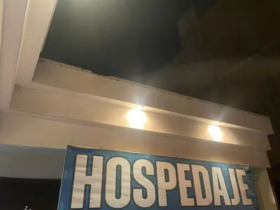 a sign for a hospedride on a wall at HOSPEDAJE VISTA Del SOL PARACAS in Paracas