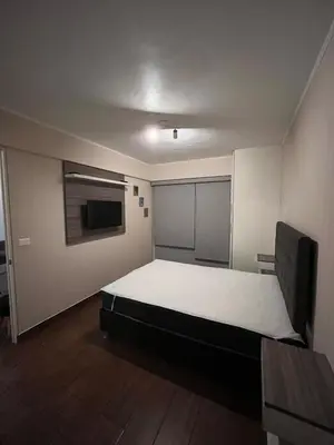 a bedroom with a large bed in a room at Moderno Departamento en Lima - Chorrillos in Lima