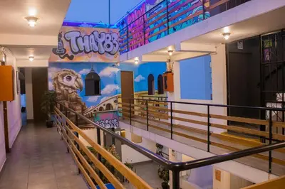a view of a church with a dinosaur painted on the wall at Miraflores Thay Colonial in Lima
