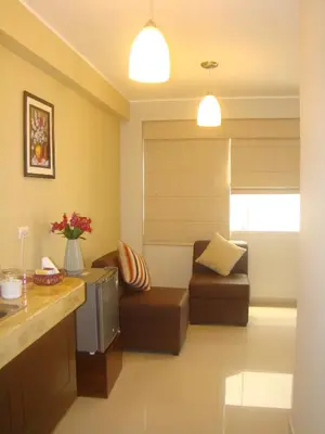 a living room with a couch and a chair at Mauri in Huánuco