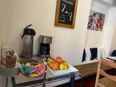 a glass table with a tray of fruit on it at Runa House2 in Cusco