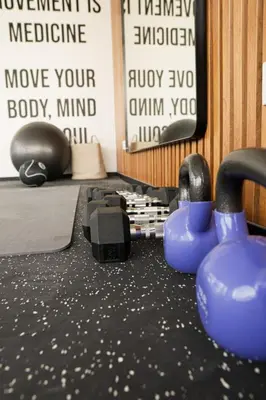 a gym with dumbbells on the floor in a room at 1BDR Modern apartment in Barranco in Lima