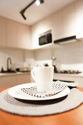 a coffee cup sitting on a table in a kitchen at 1BDR Modern apartment in Barranco in Lima