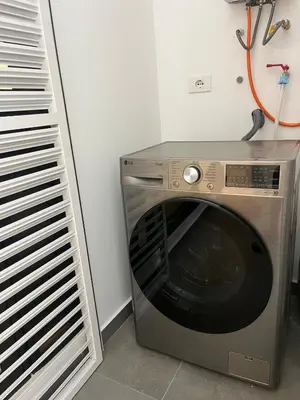 a washing machine sitting in a room next to a wall at 1BDR Modern apartment in Barranco in Lima