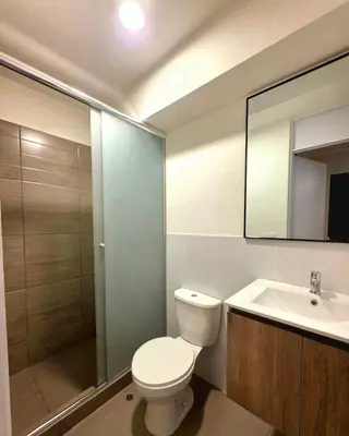 a bathroom with a toilet and a sink and a shower at Lujoso departamento y céntrico en Lima in Lima