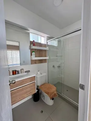 a bathroom with a toilet and a glass shower at Large Apartment - Santa Beatriz 3 Bedrooms in Lima