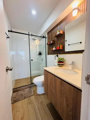 a bathroom with a shower and a toilet and a sink at Apartamento moderno en Miraflores in Lima