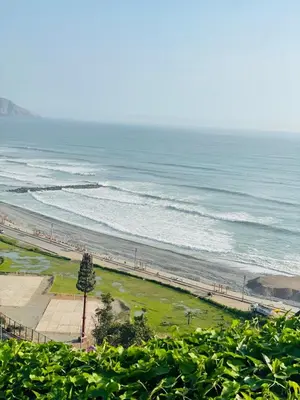 a view of a beach with the ocean at Apartamento moderno en Miraflores in Lima
