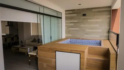 a large jacuzzi tub in a room with a table at Punta Caleta Punta Hermosa in Punta Hermosa