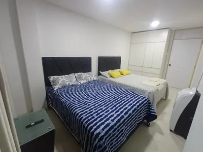 a bedroom with two beds in a room at La Casa de la Emperatriz in Ica