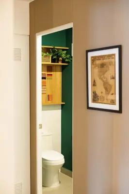 a bathroom with a toilet and a picture on the wall at 5 stars Stylish Andean Stay - CUSCO in Cusco