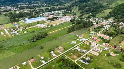 an aerial view of a village with houses and trees at La Casa de ANNI in Oxapampa