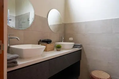 a bathroom with a sink and a mirror at Casa Cieneguilla in Cieneguilla